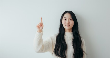 Portrait of smiling business woman pointing finger