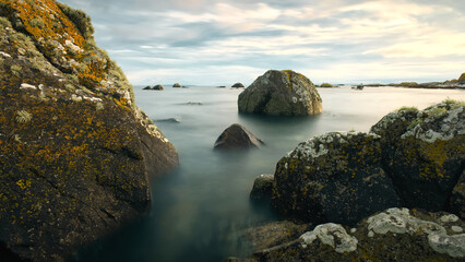 Beautiful coastal landscape scenery, rocky coast of wild Atlantic way at sunset, nature background, wallpaper, long exposure
