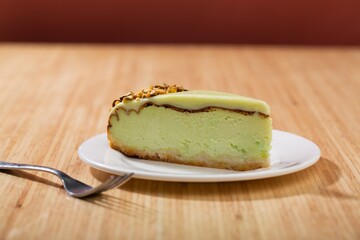 Slice of  sweet Pie with Cream on a white plate