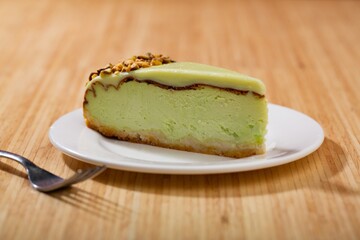 Slice of  sweet Pie with Cream on a white plate