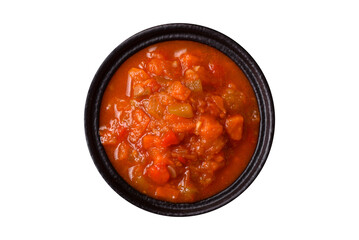 Red hot or spicy sauce with chili peppers, tomatoes, garlic, spices