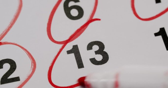 Red marker circling important dates on a calendar. Great for concepts about deadlines, appointments, reminders, and time management.