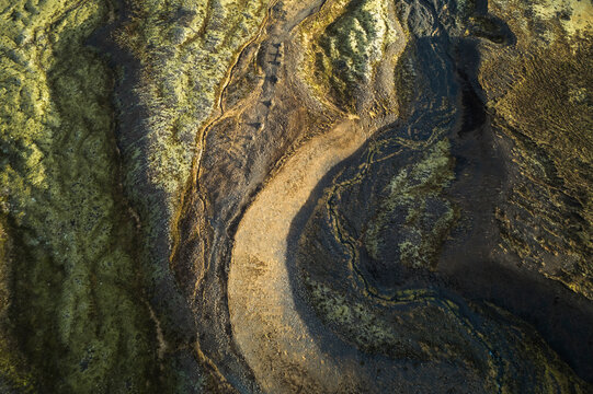 Aerial view of abstract landscape with sand and water, Hellnar, Arnarstapi, Iceland.