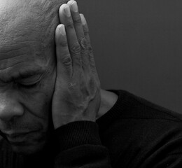 deaf man suffering from deafness and hearing loss on grey background with people stock image stock...