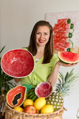 girl holding a homemade ceramic plate like a watermelon