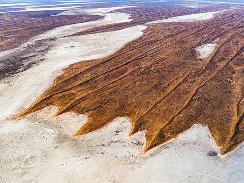 Aerial view of sand dunes and river in Simpson Desert, Kalamurina, South Australia, Australia.