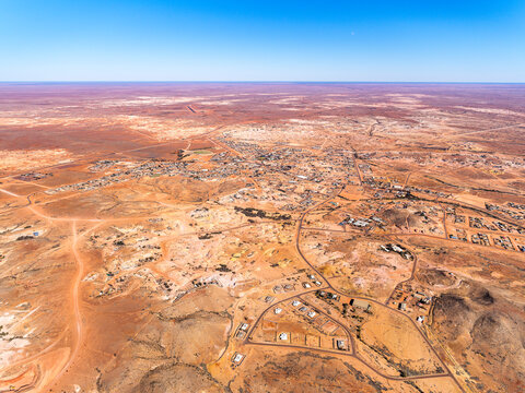 Aerial view of remote opal mining town in arid desert terrain, Coober Pedy, South Australia, Australia.