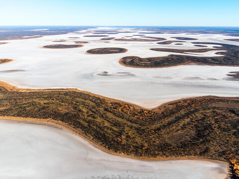 Aerial view of Lake Amadeus, salt lake in vast wilderness, Petermann, Northern Territory, Australia.