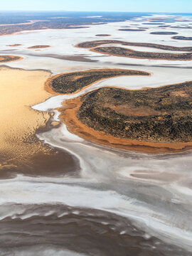 Aerial view of Lake Amadeus, salt lake with desert patterns and texture, Petermann, Northern Territory, Australia.