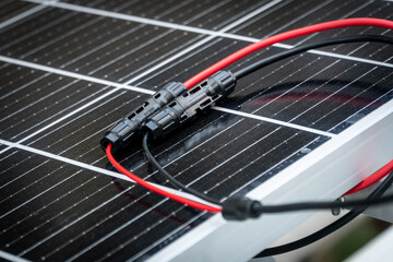 Close up of  mc4 connectors over the solar panel.