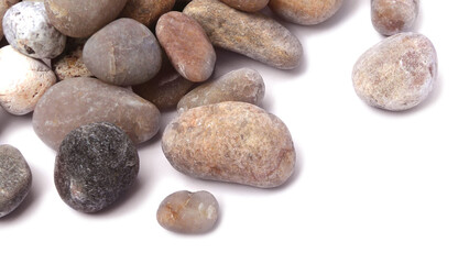 Pebbles piled on white background