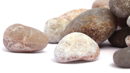 Pebbles piled on white background