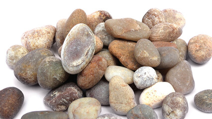 Pebbles piled on white background