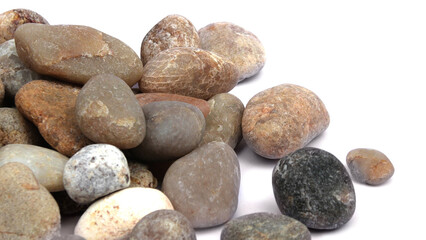 Pebbles piled on white background