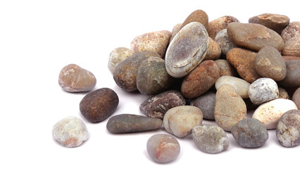 Pebbles piled on white background