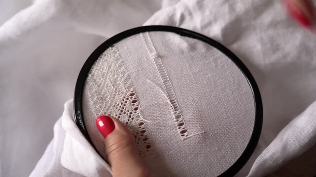 Embroidery Stitches for a Lace Design on White Fabric. Process of creating traditional Ukrainian embroidery