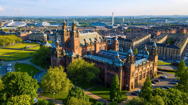Aerial view of Kelvingrove Museum surrounded by greenery and historic buildings, Glasgow, Scotland.