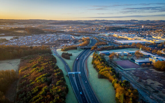 Aerial view of cityscape with forest and buildings, Pollock, Glasgow, Scotland.