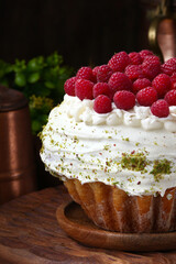 cupcake with frosting and fresh berries