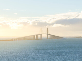 Aerial view of Skyway Bridge over Tampa Bay at sunset, St Petersburg, Florida, United States.