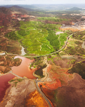 Aerial view of Copper Mine landscape with Red River and Green Hills, Minas de Riotinto, Spain.