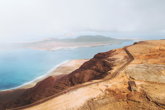 Aerial view of hazy, scenic La Graciosa Island and Mirador del Rio, Lanzarote, Canary Islands, Spain.