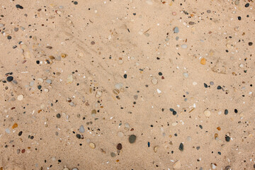 Overhead view of the small rocks and pebbles in the beach sand at Kohler-Andrae State Park, Sheboygan, Wisconsin.