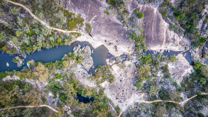 Aerial view of untouched wilderness with creek, rock formations, and forest, Girraween National Park, Granite Belt, Bald Rock Creek, Queensland, Australia.