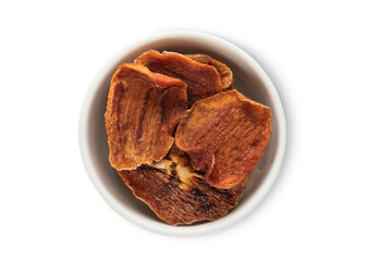 Ceramic bowl with dried healthy persimmon kaki pieces isolated on white background.Top view.
