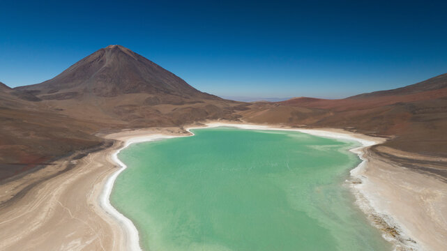 Aerial view of Laguna Blanca in desert with mountain backdrop, San Pablo, Potosi, Bolivia.
