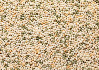 Assorted mix of raw healthy dry couscous grain seeds textured background.Macro.