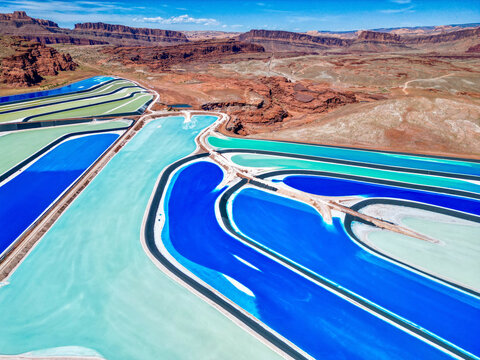 Aerial view of colorful potash ponds and rock formations in Monticello pools, Utah, United States.