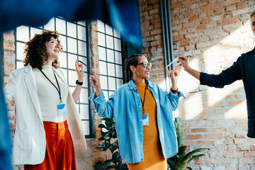 Coworkers participating in a trust-building game during a workplace training session