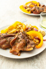 Enjoy a hearty breakfast or lunch with baked turkey served alongside roasted zucchini, sweet peppers, and onions