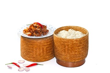 Pictures of food Thailand with sticky rice and fried pork serving with chili and onions sliced on white background in isolated concept.