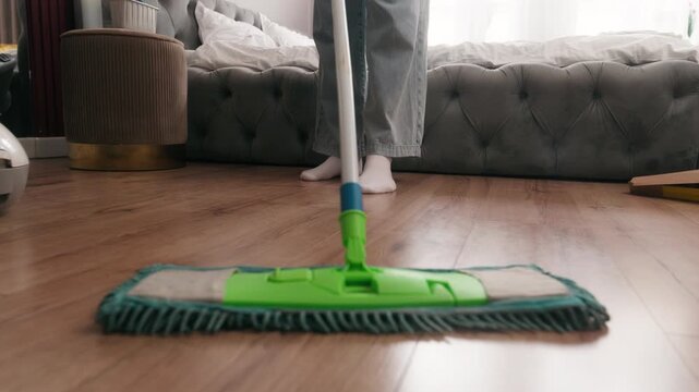Unrecognizable woman girl lady female housewife homeowner cleaner housekeeper housemaid home cleaning in bedroom wiping dust washing mop floor housekeeping household chores mopping clean house neat