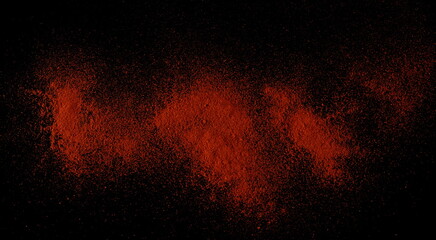 Pile of red paprika powder isolated on black background, clipping	