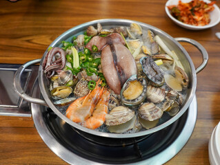 Seafood soup with various seafood such as abalone, conch, squid, shrimp, etc
