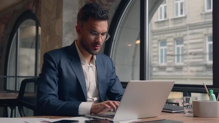 Indian Arabian man business male guy employer finish complete project working day end at office close laptop relaxed happy satisfied free businessman put hands behind head relax on chair rest smile