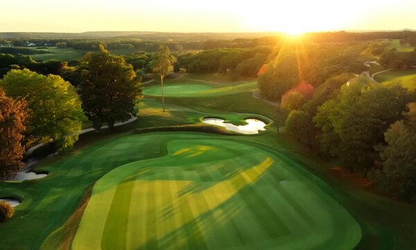 Overhead shot of a beautifully landscaped golf course. 4K Video hyperrealistic