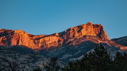 Sunrise illuminating the peaks of a rugged mountain range