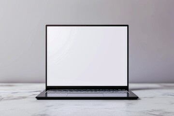 A close-up view of a laptop computer sitting on a marble table