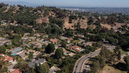 Afternoon aerial view of the sprawling neighborhood houses and hills of La Habra Heights,...