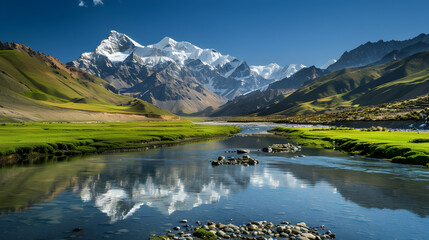 Majestic Mountain Range with Snow-Capped Peaks and Serene River under Clear Blue Sky