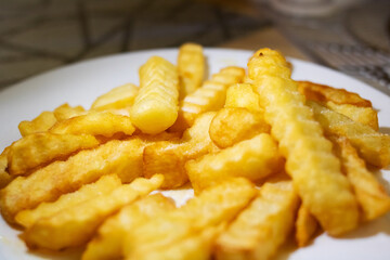 French fries on a white plate, a classic fast food dish
