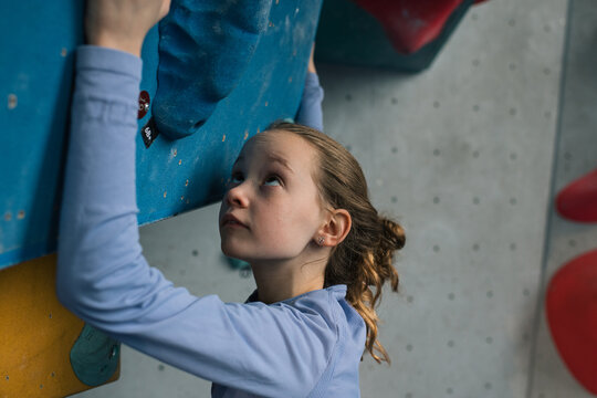 portrait of a girl climbing at an indoor climbing centre in Sweden