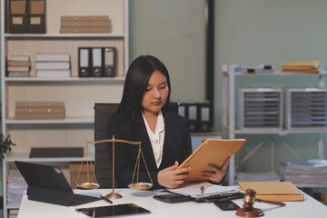 Judge gavel with Justice lawyers having team meeting at law firm background. Concepts of Law and...