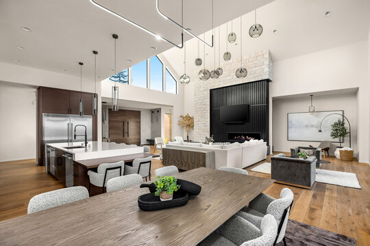 Living room, kitchen, and foyer in new luxury home