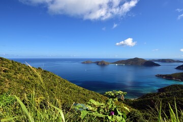 Sailing yachts in the calm bay between the islands