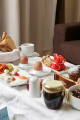  Classic hotel breakfast with various choice of food, eggs, cereals, pastry, jam, cheese and salami